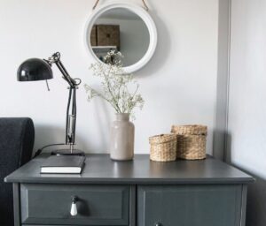 How to feel more organized. Image shows a tidy living room sideboard 