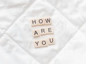 Image shows letter tiles reading ‘how are you’