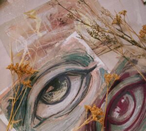Journaling for clarity. Image shows artwork of an eye and an abstract piece